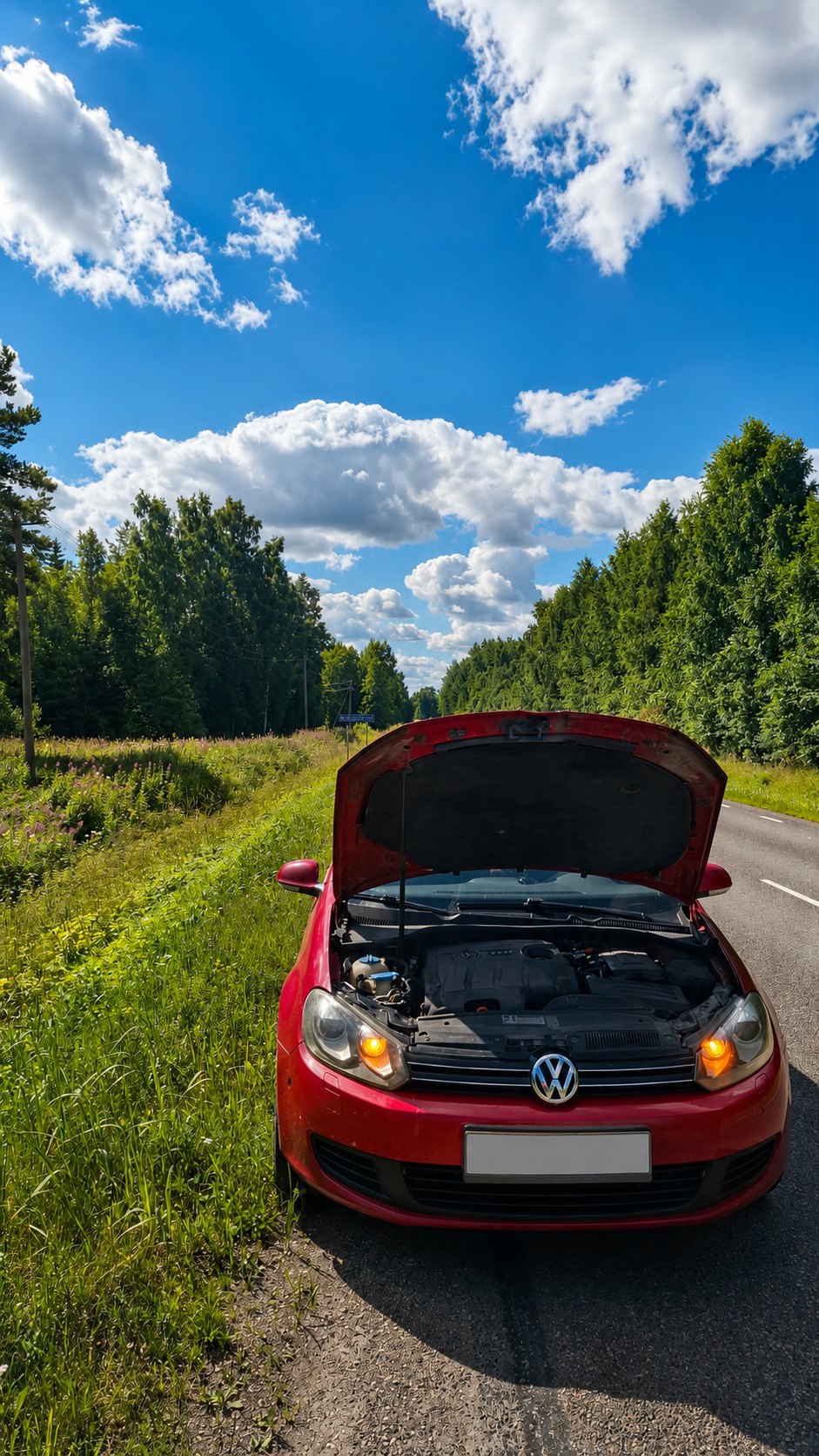 Punane auto tee ääres remondiootel